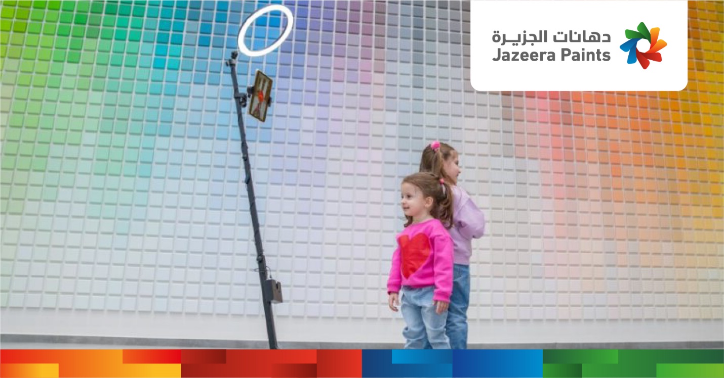 Two girls standing next to a mirror

Description automatically generated