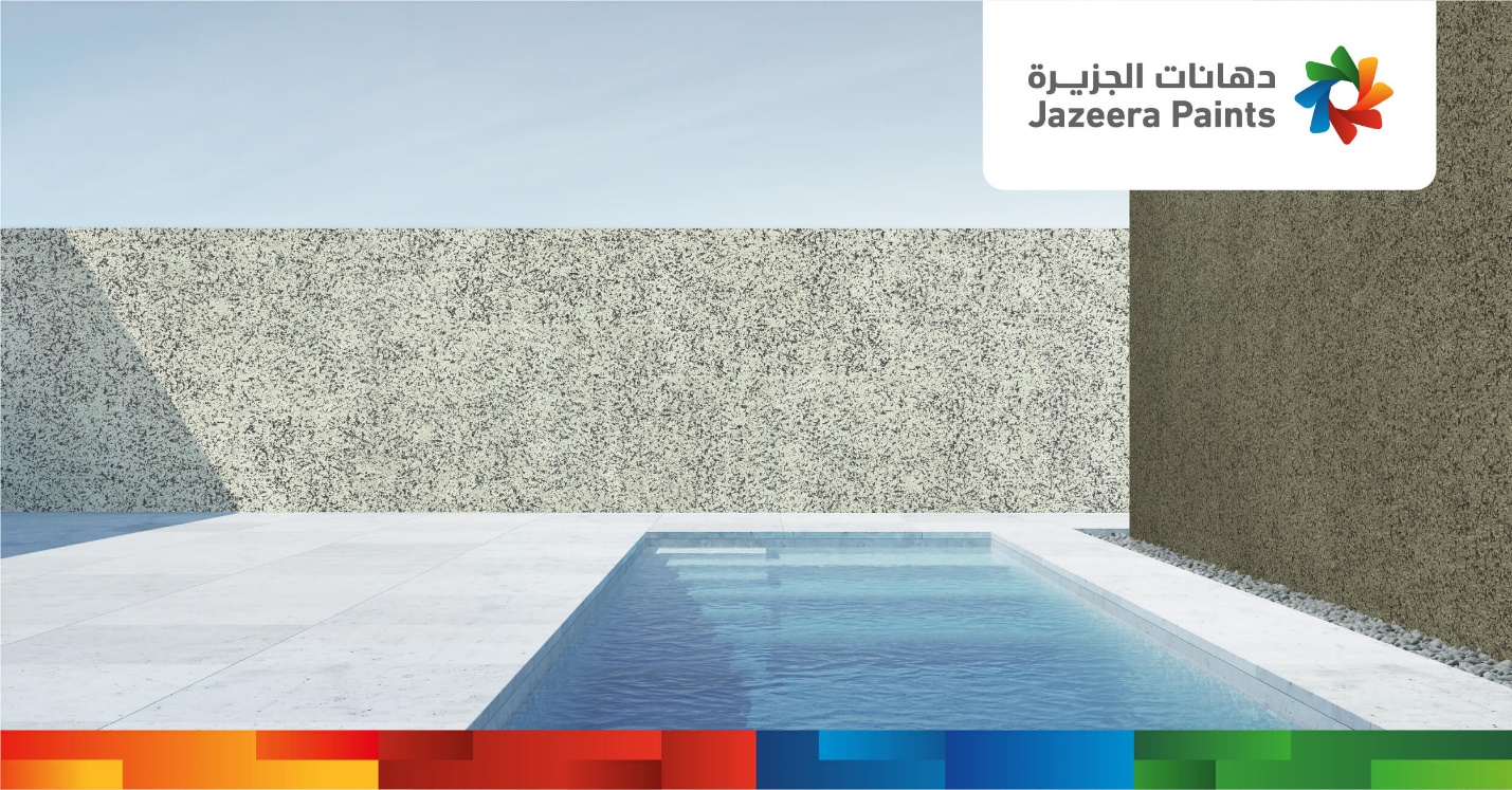 A pool with a stone wall

Description automatically generated